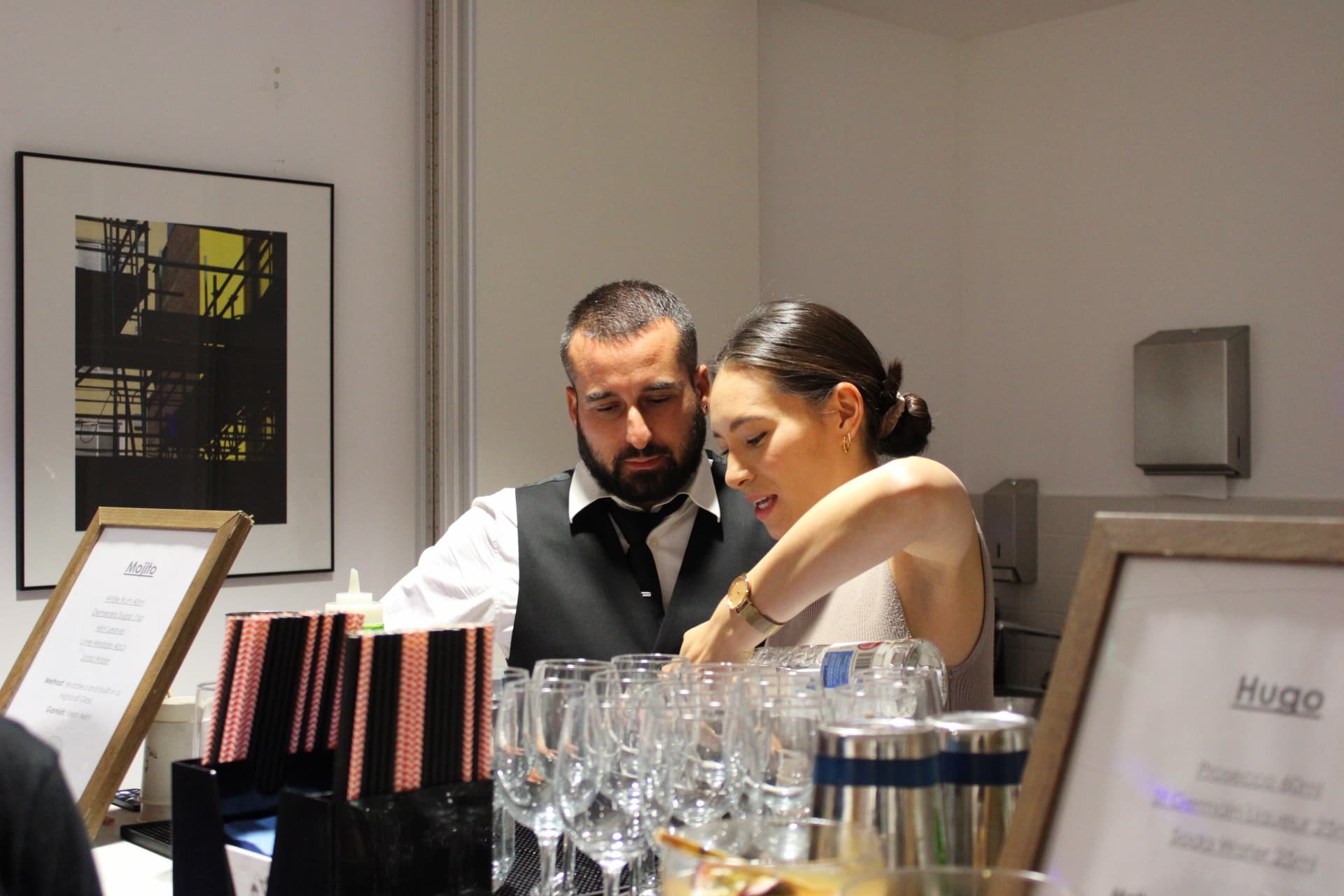 Guests laughing and mixing drinks together