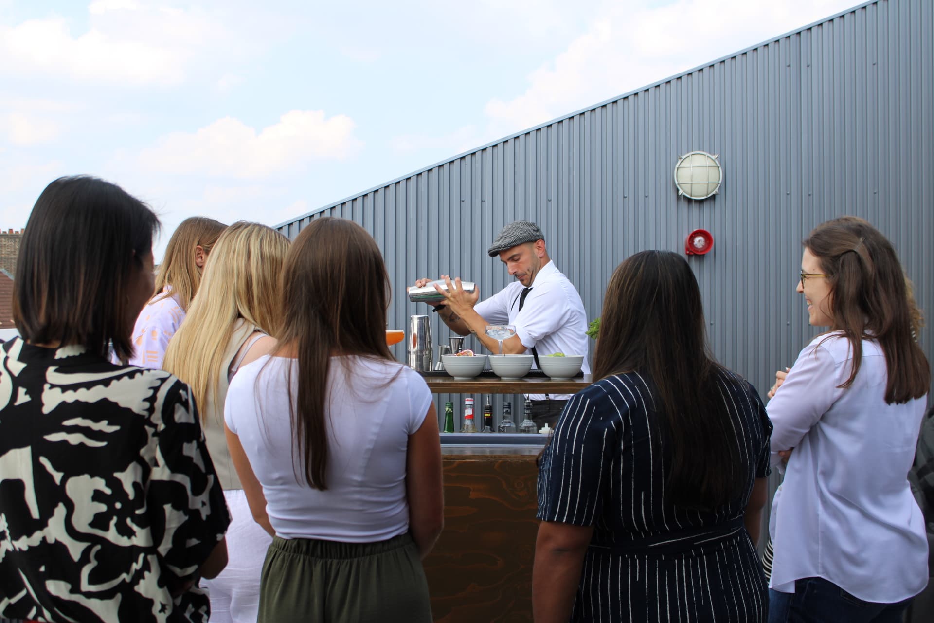 Bartender demonstrating cocktail shaking technique
