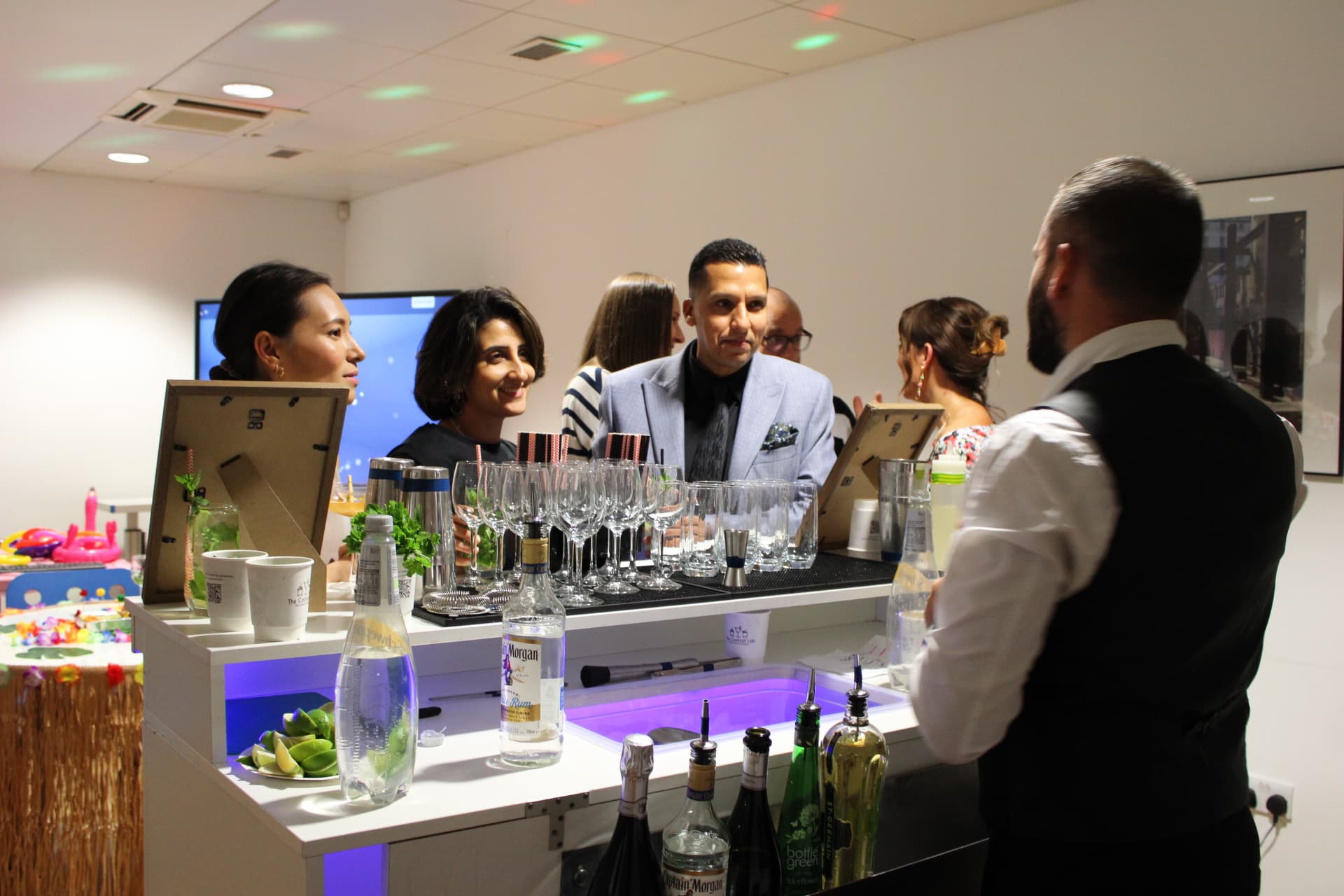 Bartender garnishing a finished cocktail
