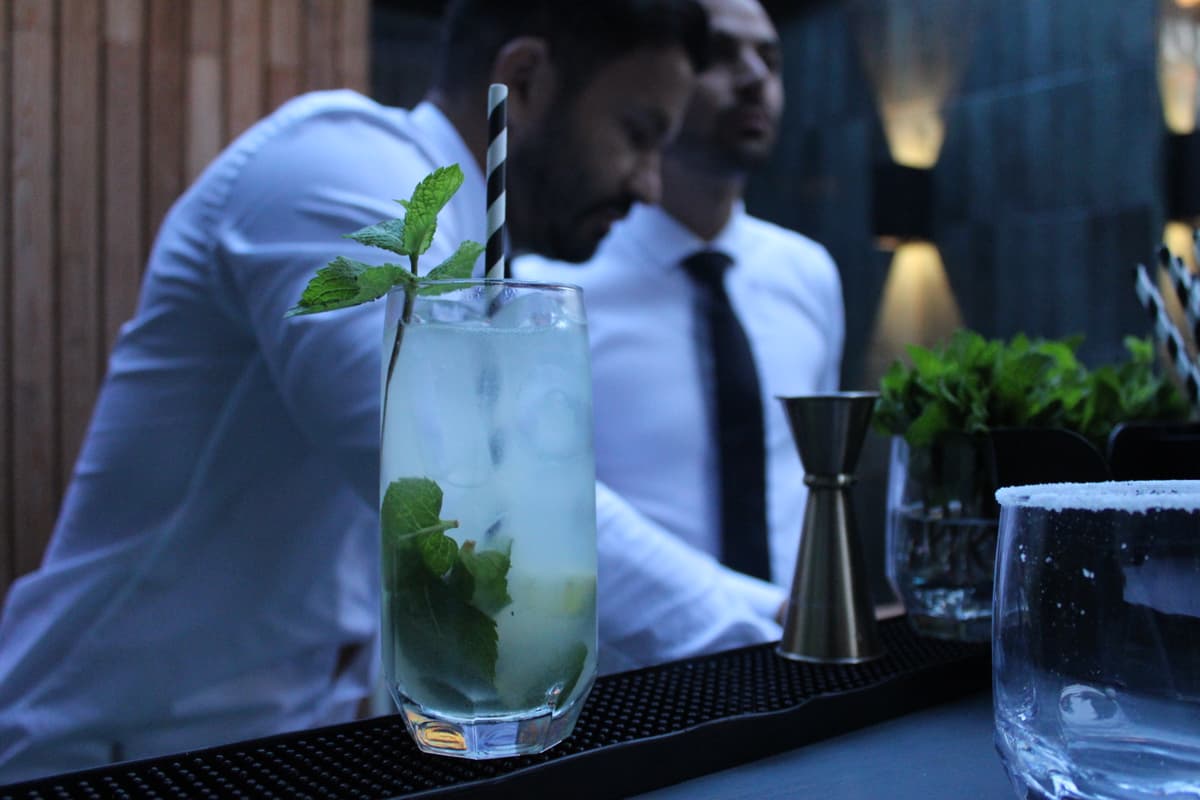 Mobile cocktail bar with champagne glasses and canapes.