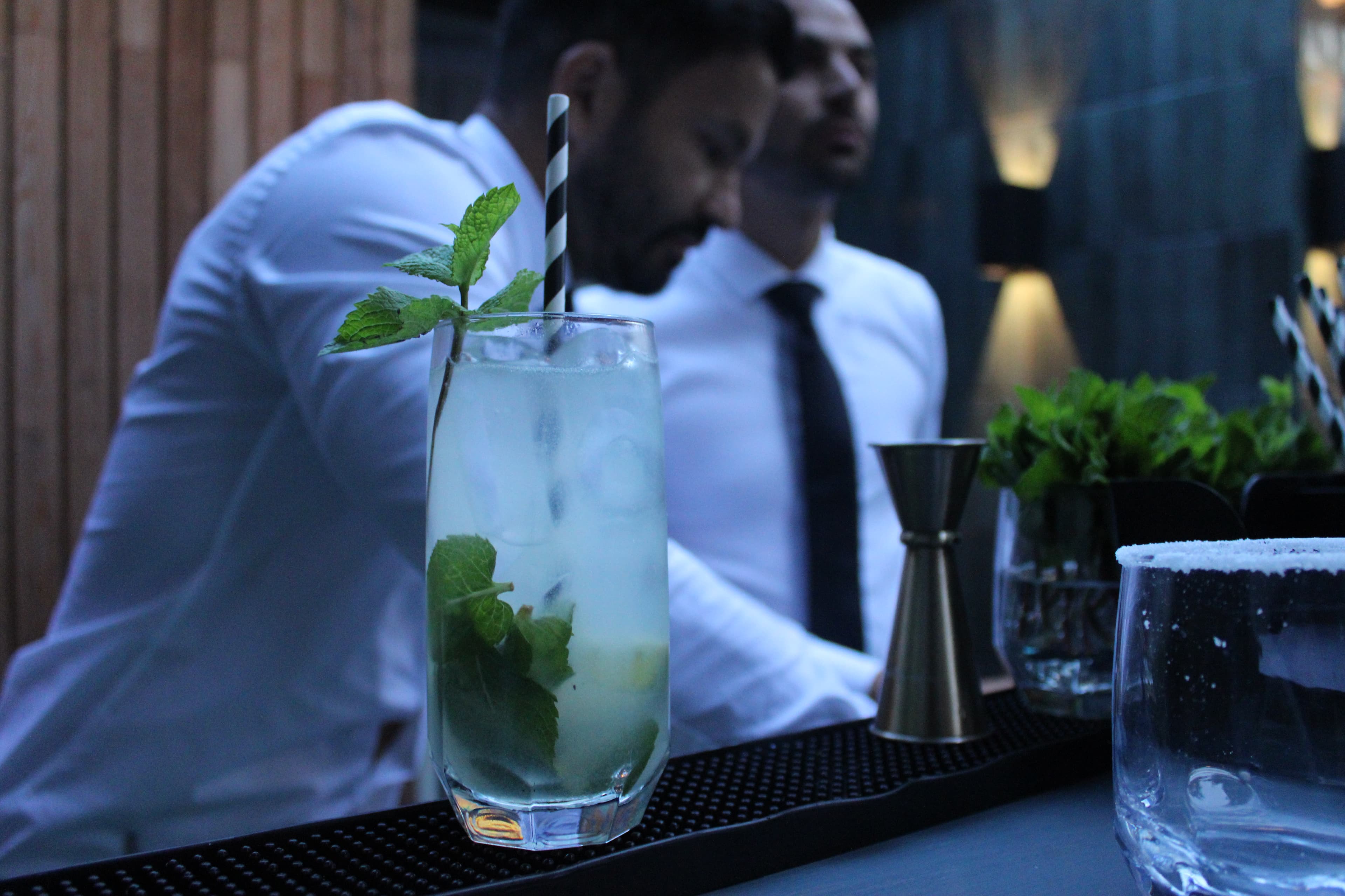 Mobile cocktail bar with champagne glasses and canapes.