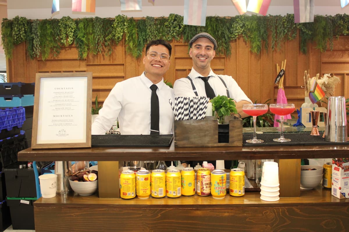 Mobile cocktail bar with champagne glasses and canapes.