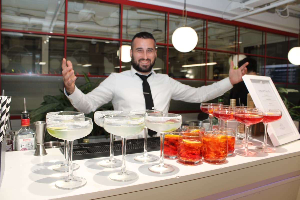 Mobile cocktail bar with champagne glasses and canapes.