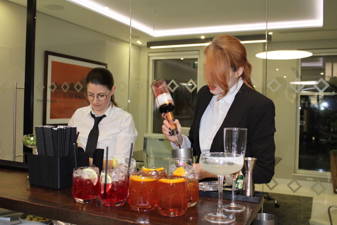 Mobile cocktail bar with champagne glasses and canapes.
