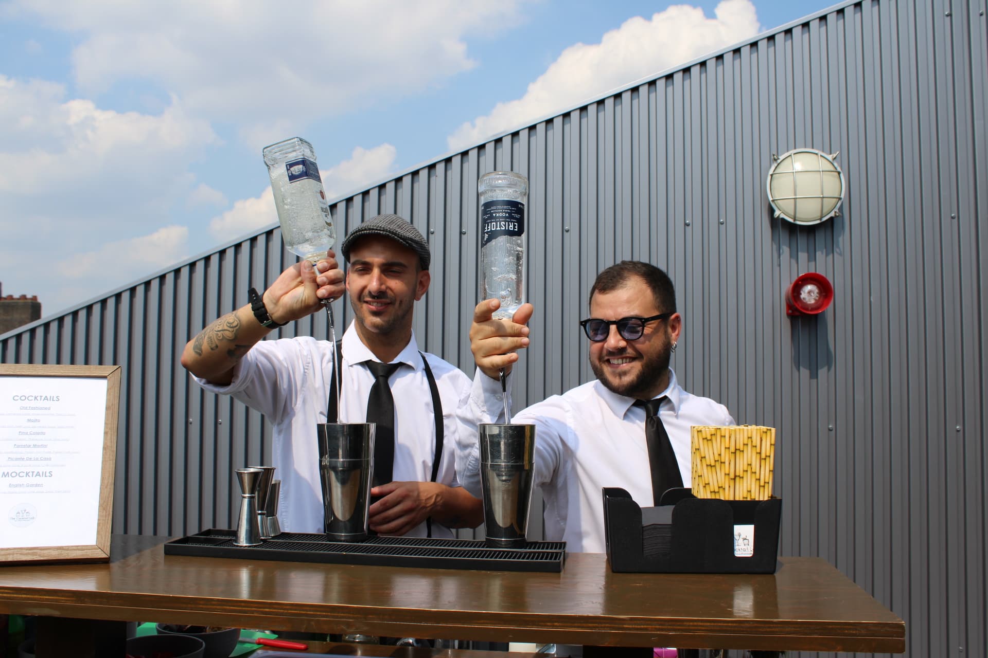 Mobile cocktail bar with champagne glasses and canapes.