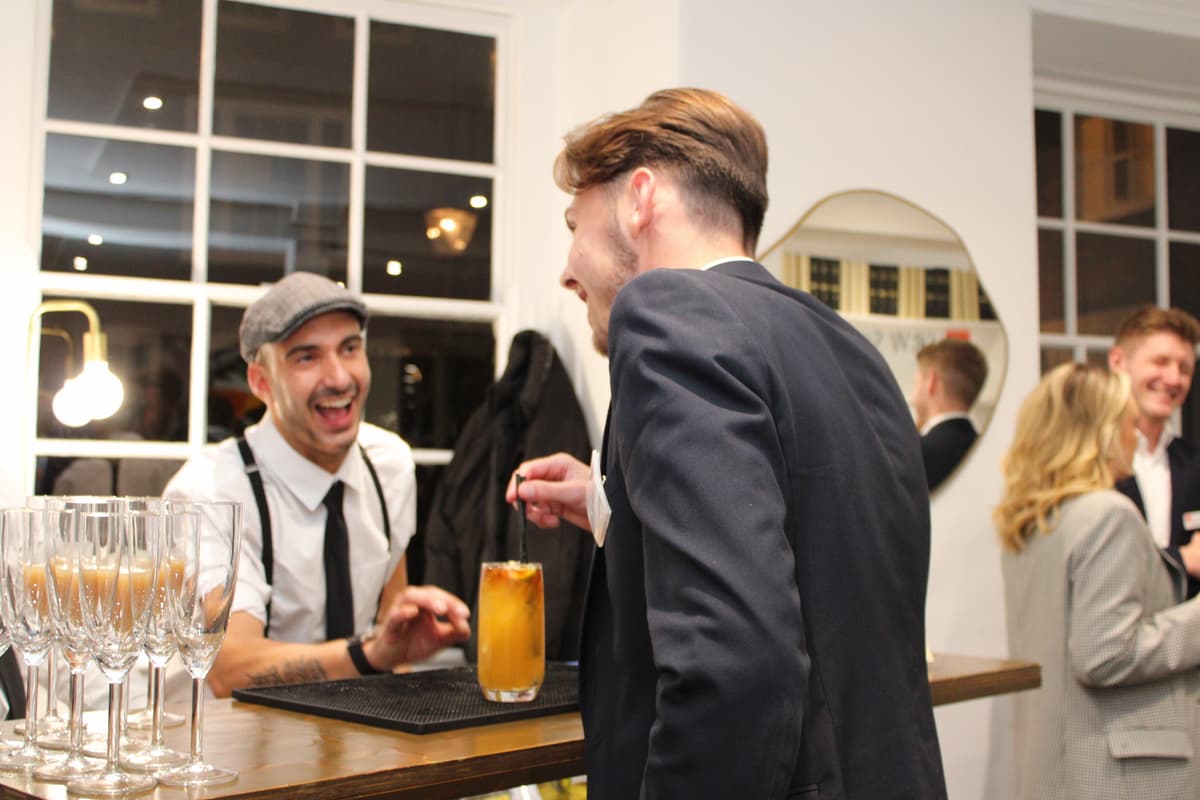 Mobile cocktail bar with champagne glasses and canapes.