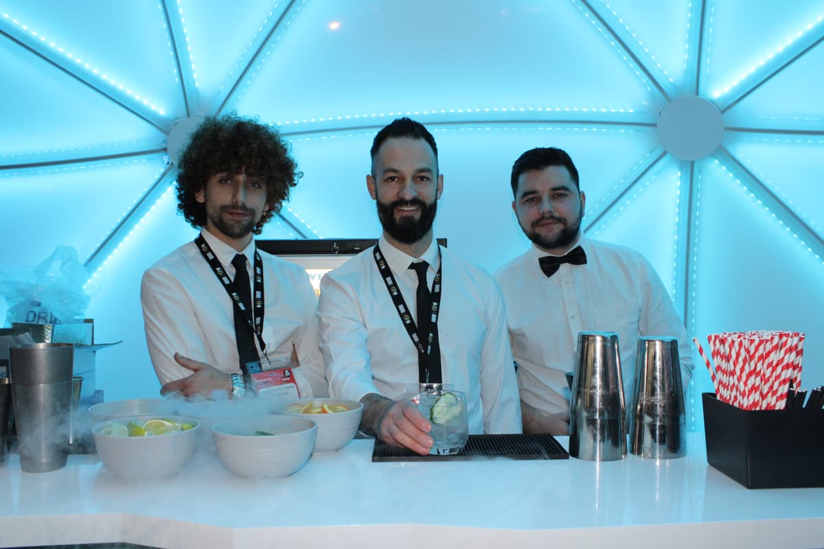 Mobile cocktail bar with champagne glasses and canapes.