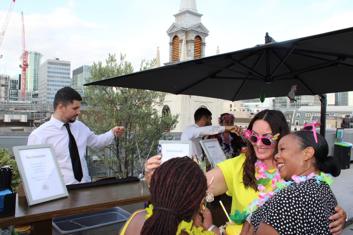Mobile cocktail bar with champagne glasses and canapes.