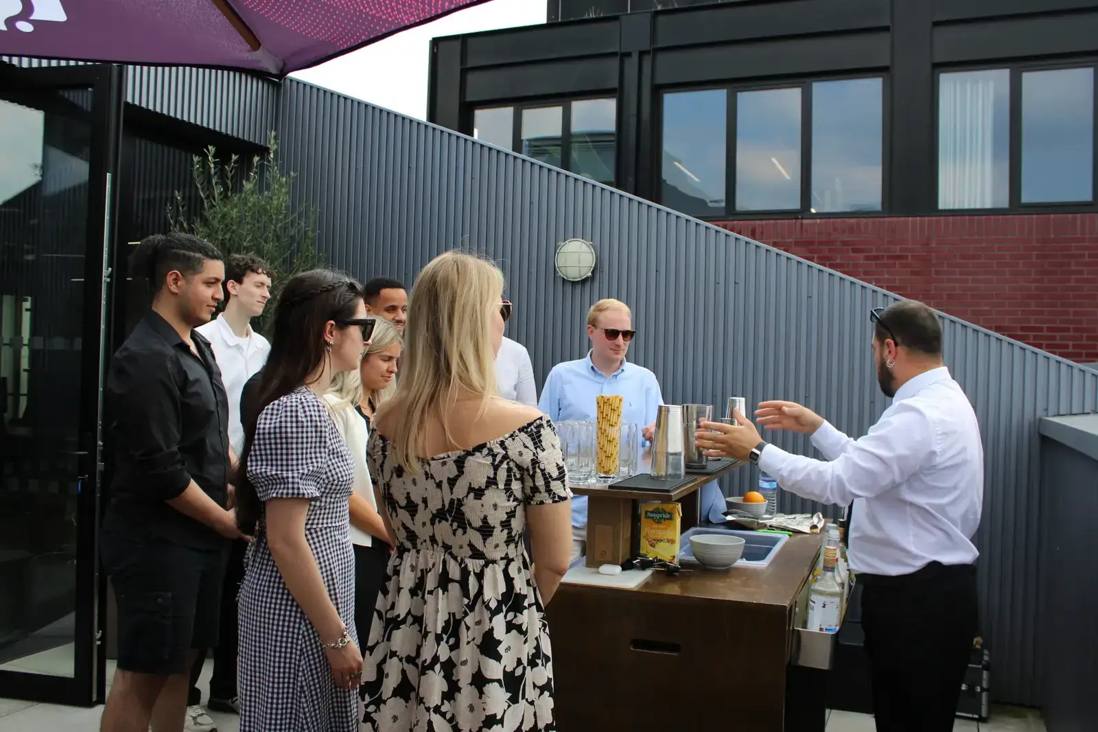 Team building cocktail class with colleagues learning mixology