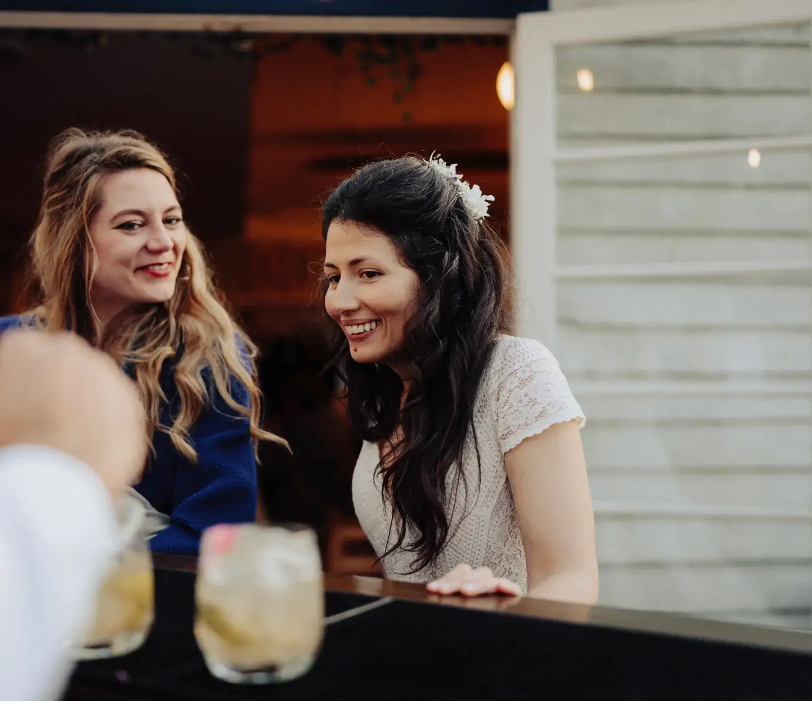 Wedding guests enjoying cocktails at reception with professional mobile bar hire service in London