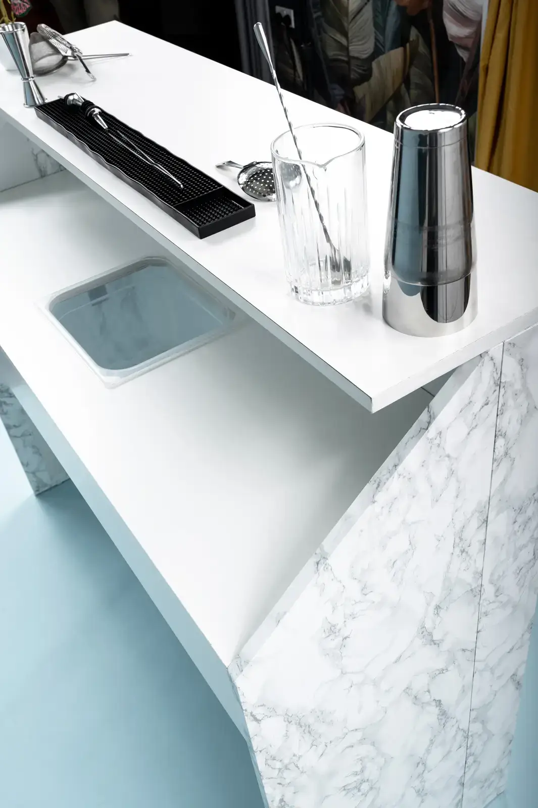 Professional cocktail service at sophisticated Italian marble stone bar