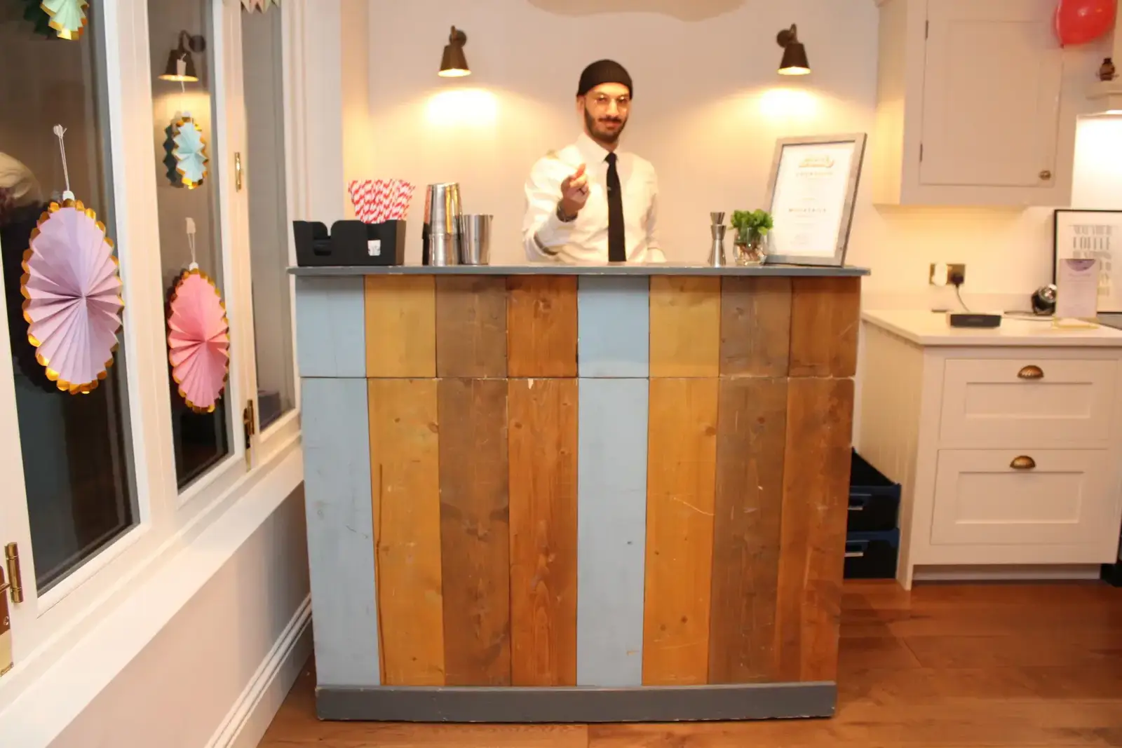 Interactive cocktail workshop at charming pastel bar in London spring garden